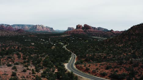 drone shot of a car driving through the arizona desert