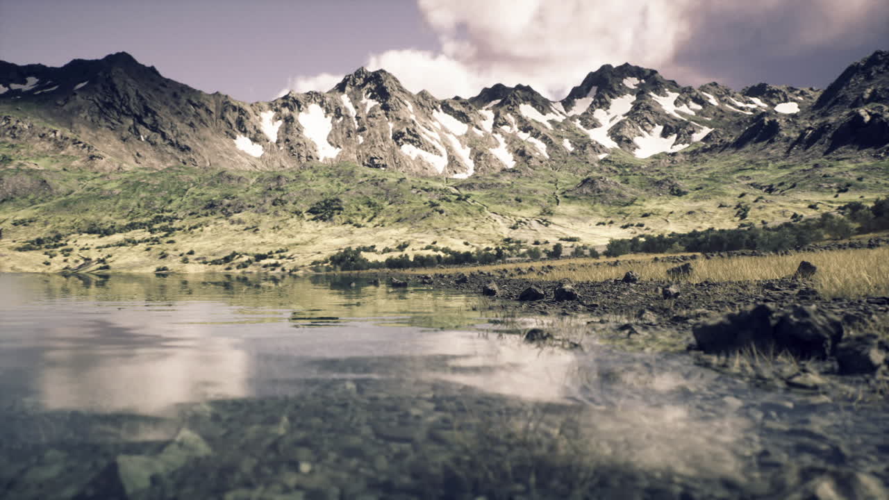 Calm highland water body showcasing rugged mountain silhouette
