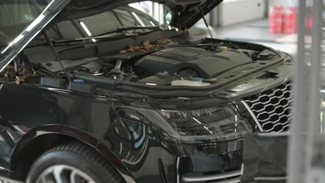 cars undergoing maintenance in auto repair shop