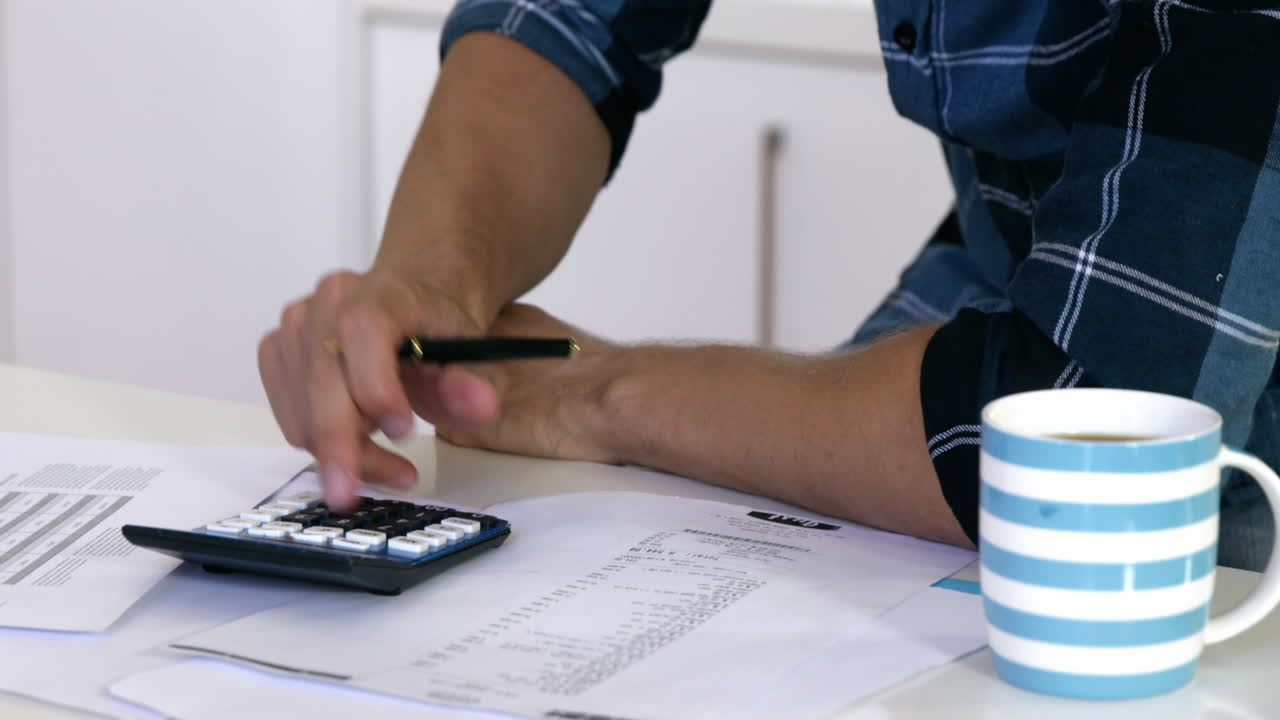 Man is calculating figure