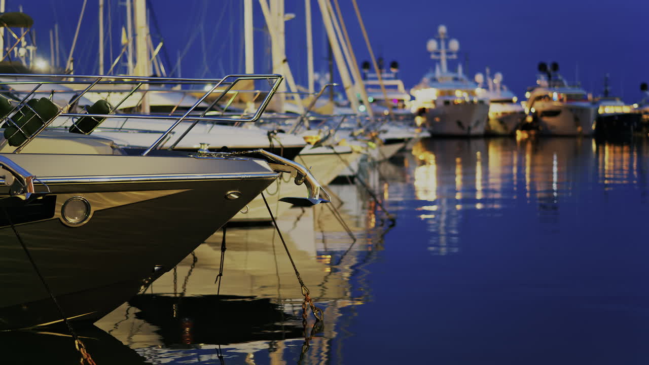 Multiple white boats docked in the Port Vauban in the evening in Antibes, France