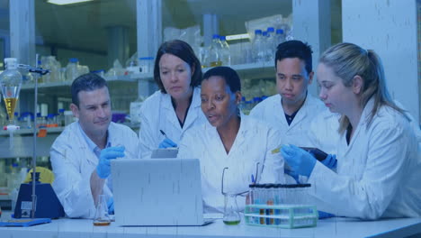 science team collaborating at lab bench, with animated graph overlays and floating flask icons