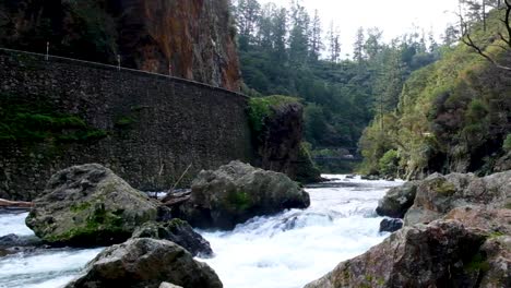 Scenic-landscape-view-of-fast-flowing-white-water-rapids-on-the-Ohinemuri-River-within-Karangahake-Gorge-in-North-Island-of-New-Zealand-Aotearoa