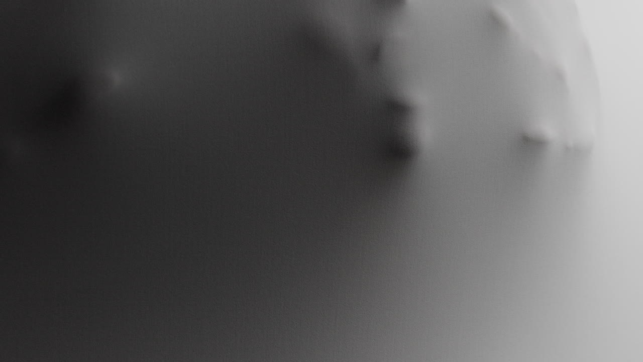 A scary face and hands appear from the white surface