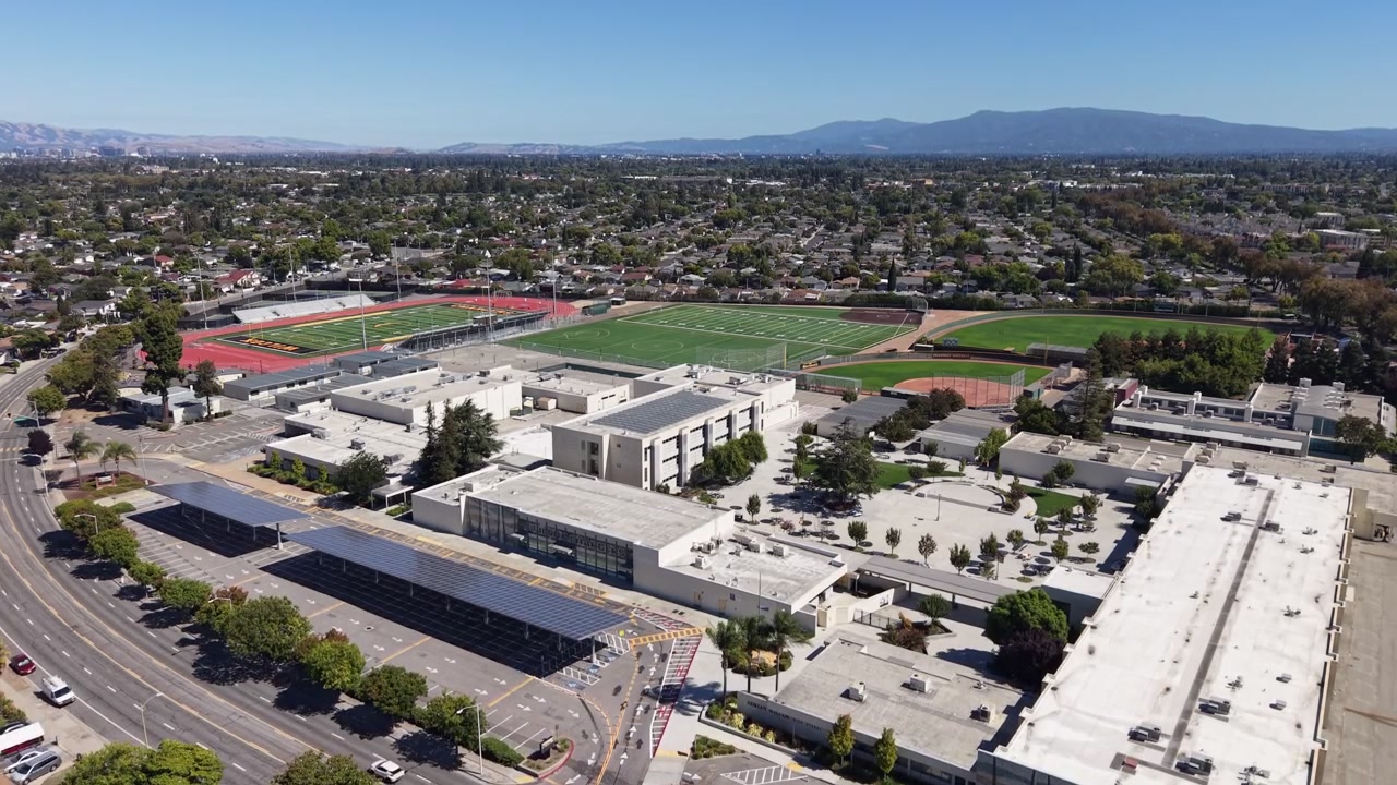 Drone captures Adrian Wilcox High School’s modern architecture, sports fields, and sprawling campus in with a sweeping sky perspective, perfect for educational and urban stock footage needs.
