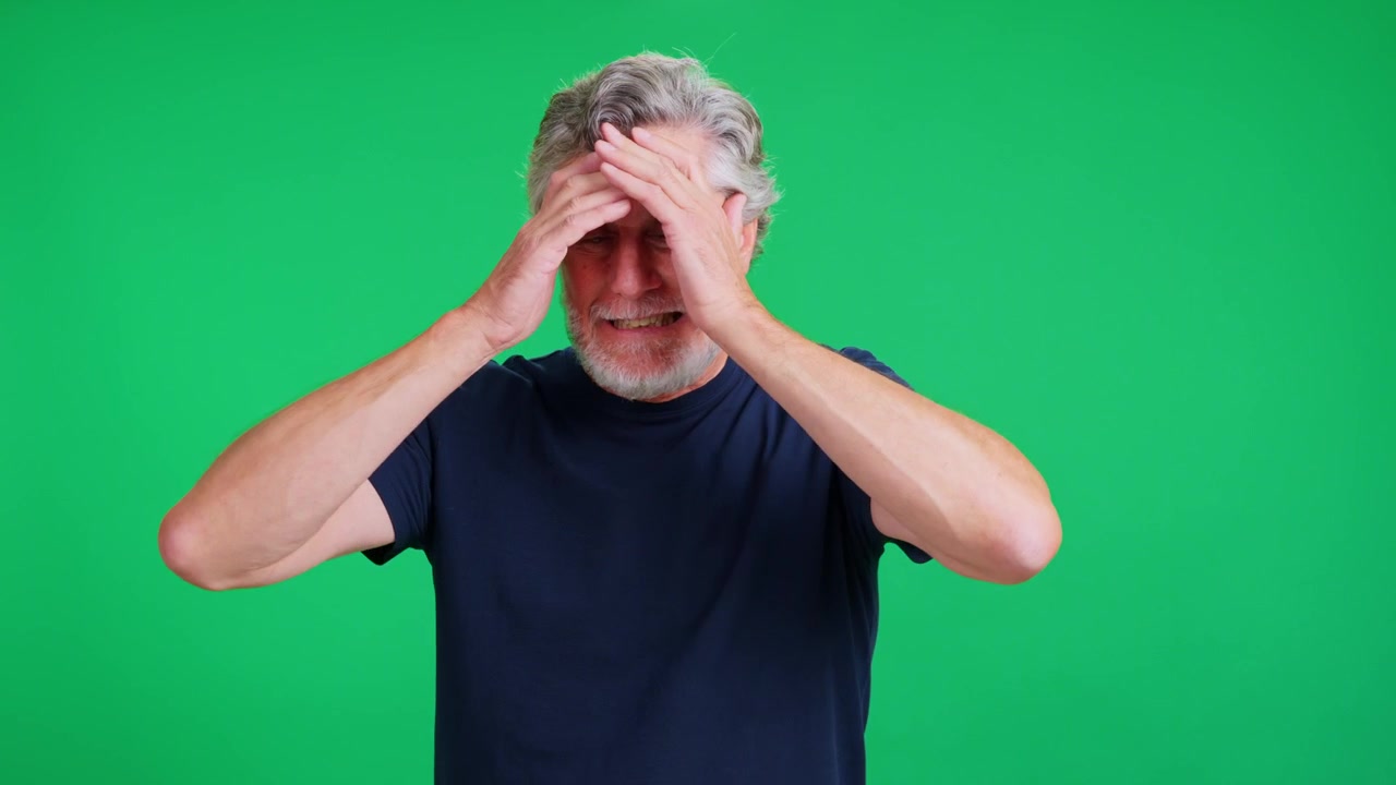 Disgruntled senior man with gray hair remembers something