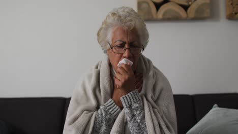 Sick-african-american-senior-woman-having-a-difficulty-in-breathing-at-home