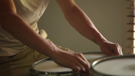 Drummer-tightening-skins-to-find-the-best-tuned-sound-possible