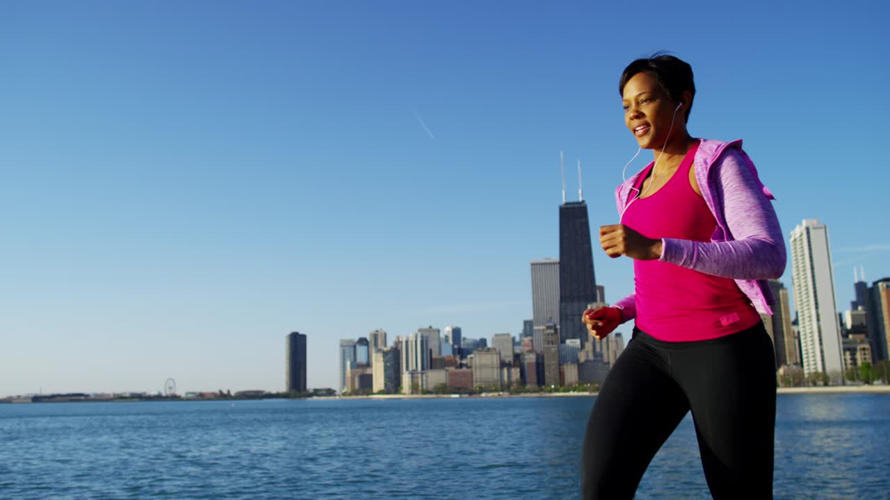 African American female running outdoors in Chicago city