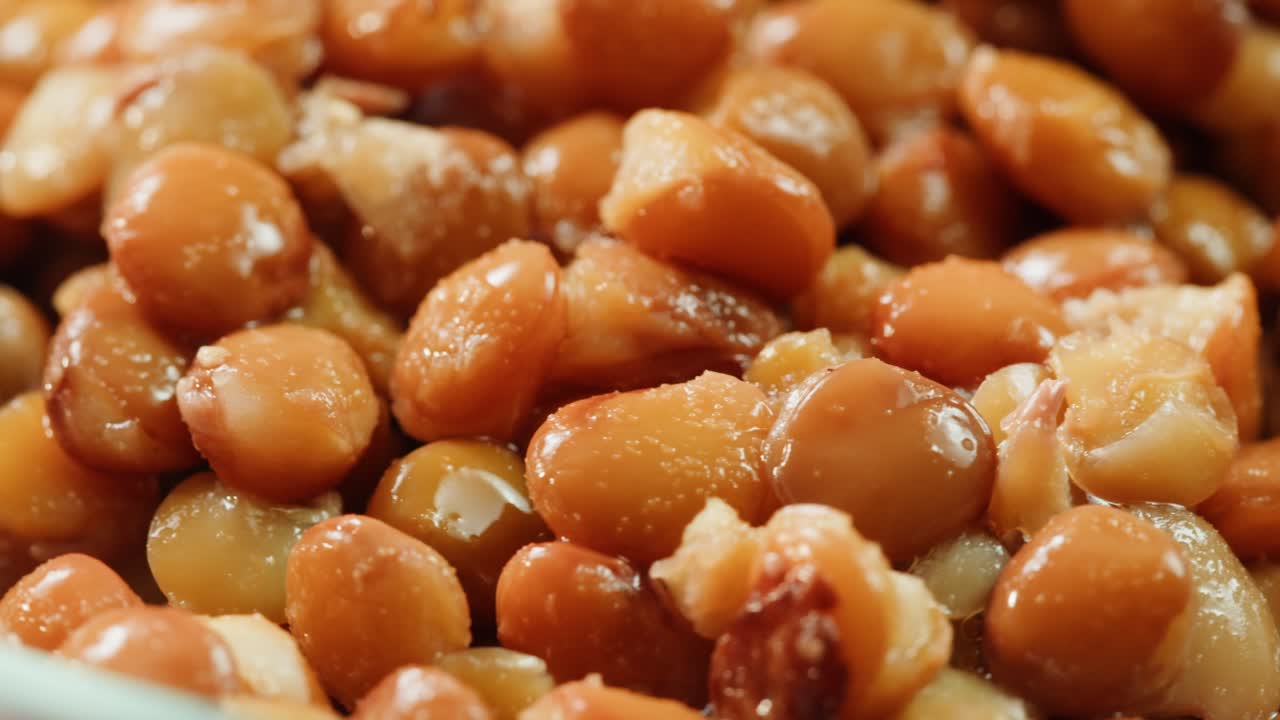 Lentils macro, Open metal can with preserved steamed brown lentils close up isolated on white background