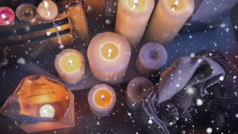 falling snow with christmas candles