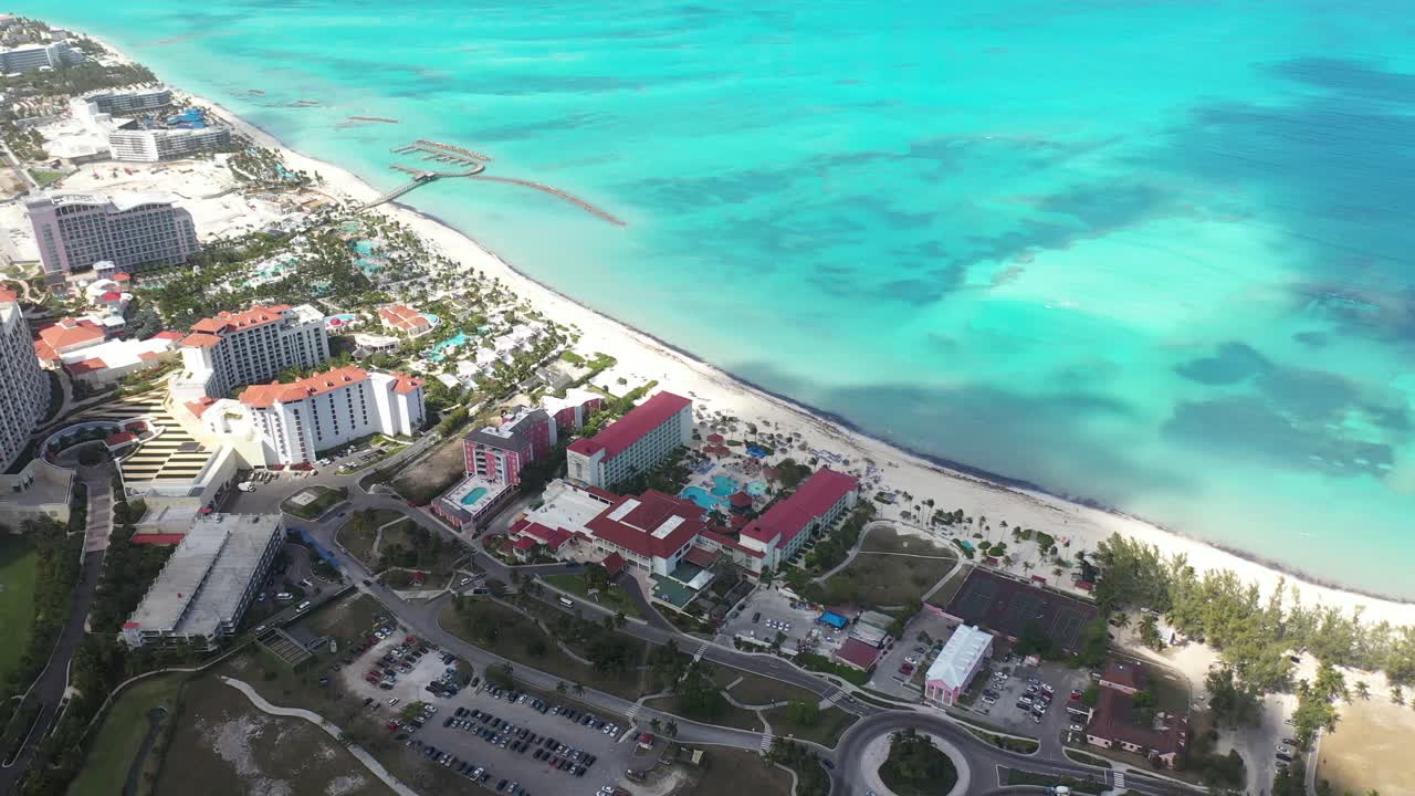 Exotic Bahamas. Drone Aerial View of Nassau Beachfront, Hotels and Resorts by White Sand Beach and Turquoise Ocean Water