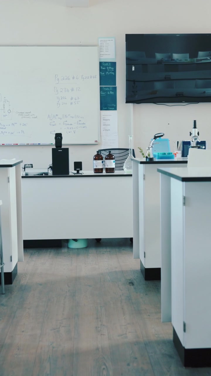 Empty Modern Science Laboratory Classroom with Whiteboards and Microscopes