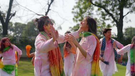 indian couple dancing in a holi festival