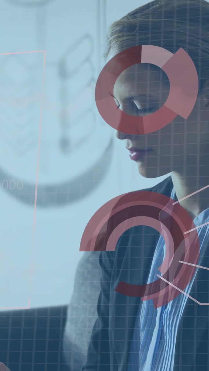 Vertical video: Woman analyst looking at device causing finance charts on face while analyzing data