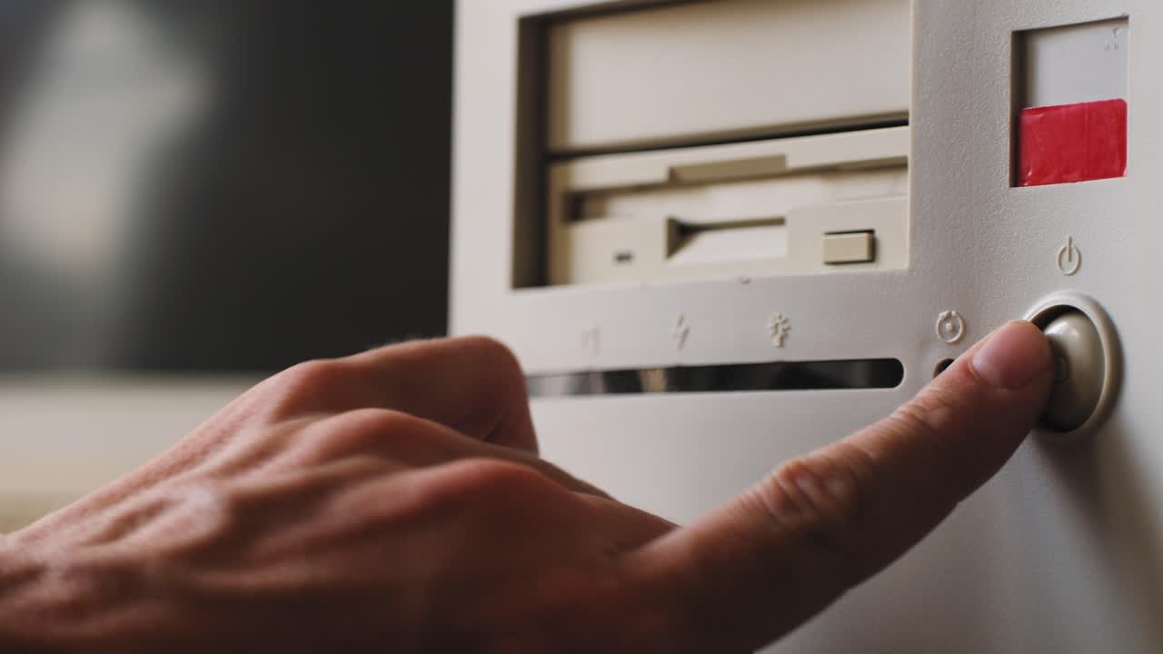 Hand turning on vintage computer