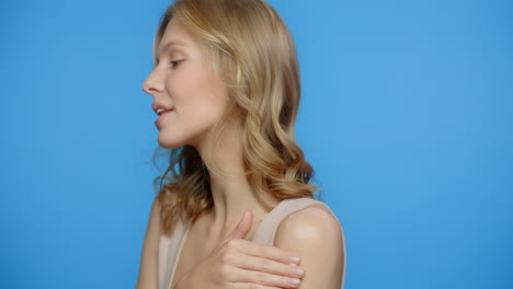 woman applying skin lotion