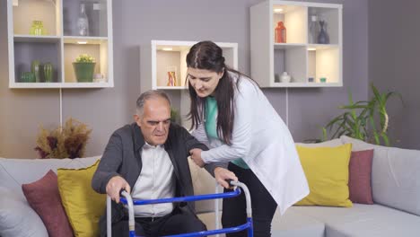 sick old man walks with the help of nurse with walker.