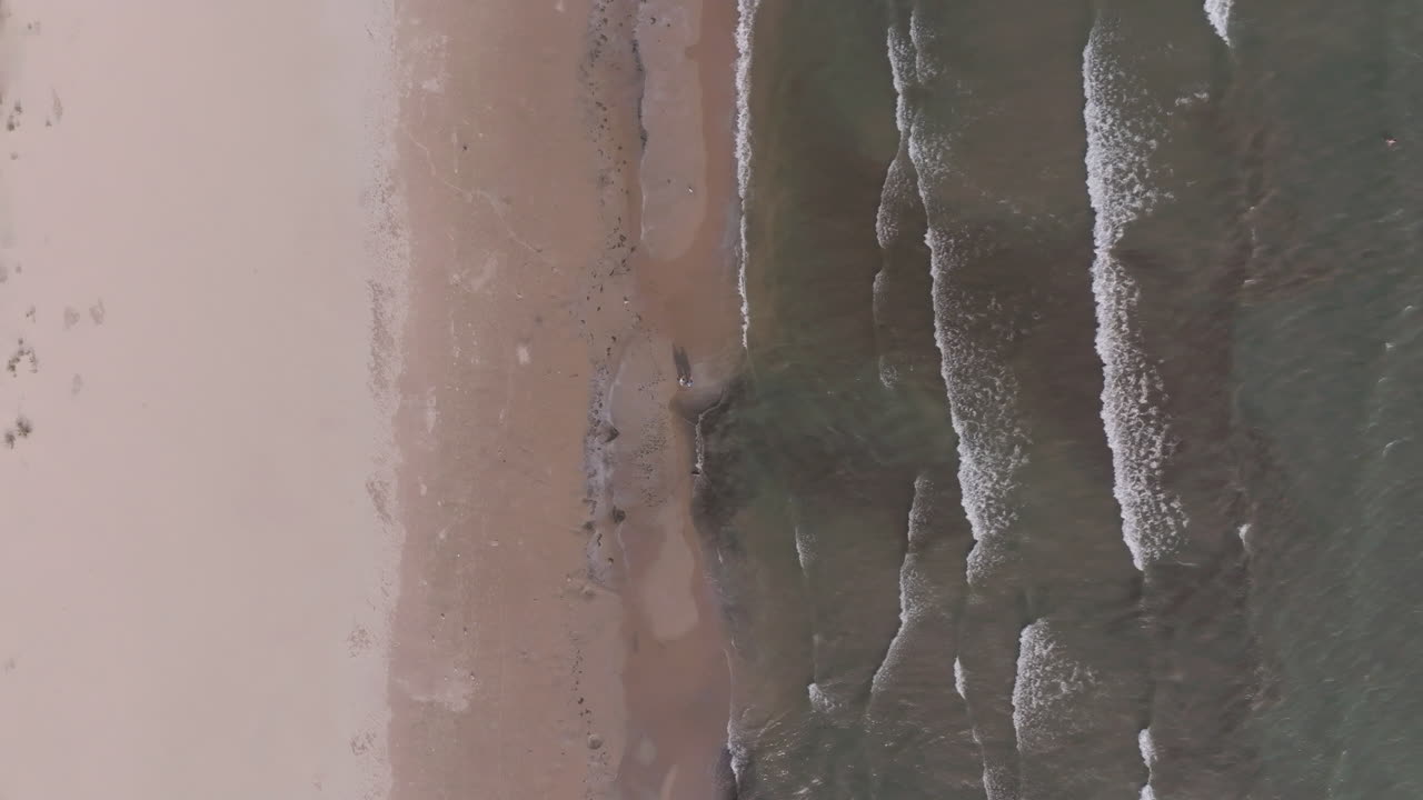Aerial view of Nickel Beach with gentle waves and serene shoreline