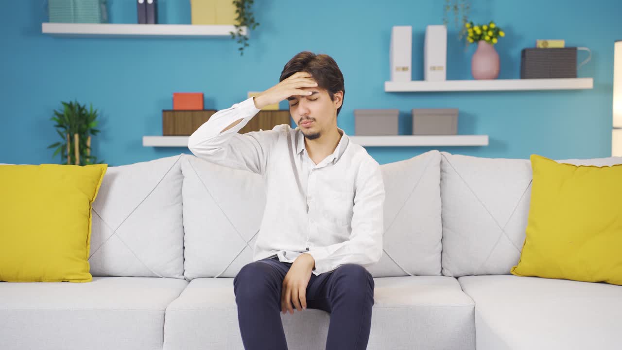 두통이 있는 남자.