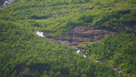 freshwater stream flow down mountains of norway