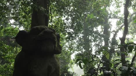 tiger lion stone carving statue bali monkey forest ubud indonesia tourist attraction nature