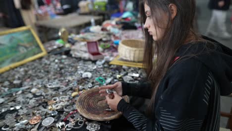 woman browsing a flea market stall