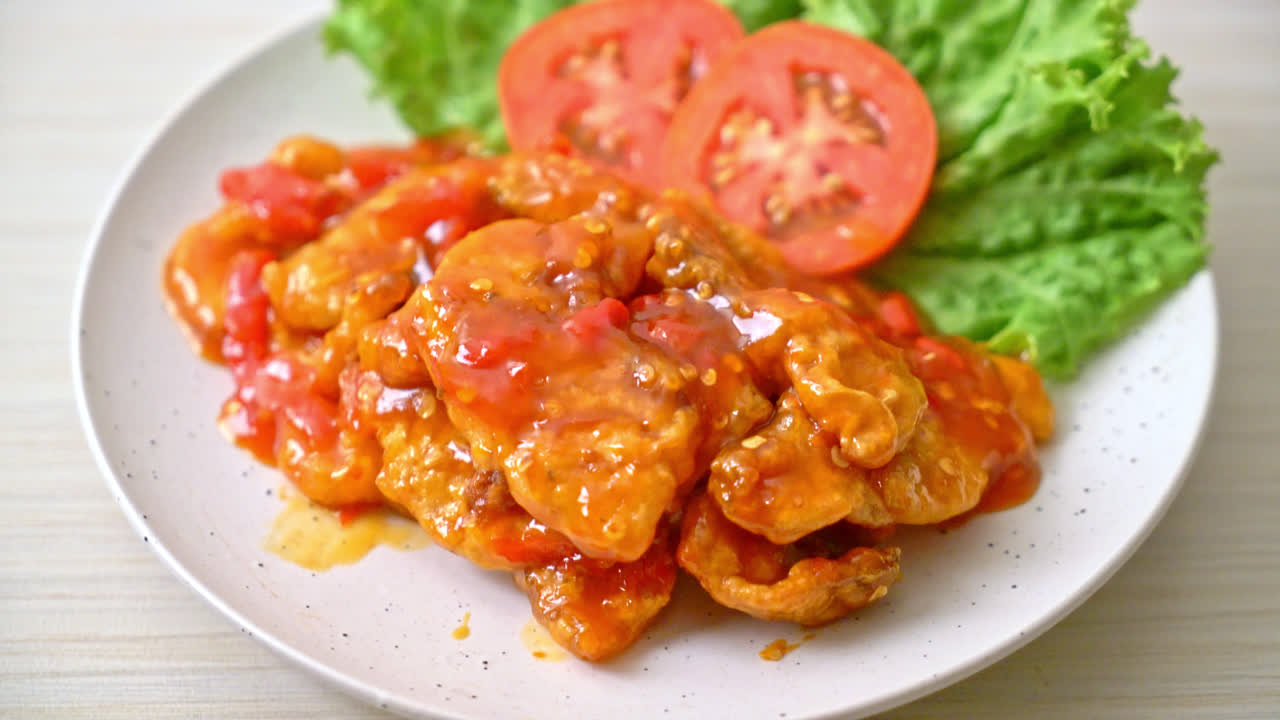 Fried fish topped with three flavors (sweet, sour, spicy) chili sauce