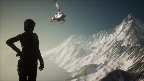 woman and helicopter in winter mountains