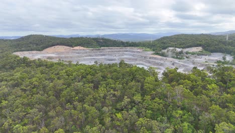 drone captures quarry amidst lush green forest