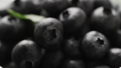 micro video of close up of blueberries with copy space