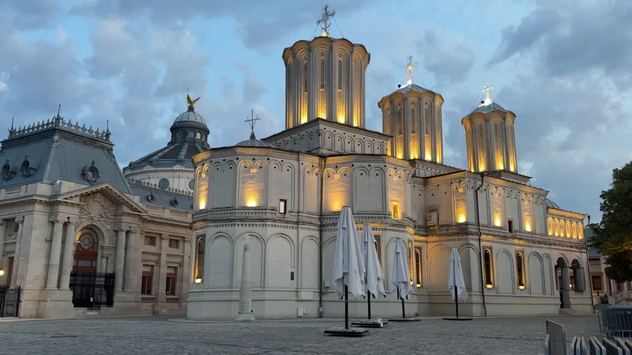 Patriarhala cathedral illuminated at twilight in Bucharest. Panning
