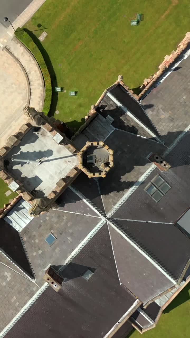 Descending overhead social ratio aerial video of Queen's University, Belfast on a bright and sunny day. Filmed in 1080x1920, 60fps and with Rec709 color