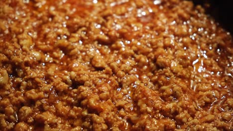 close up of cooked ground meat in sauce