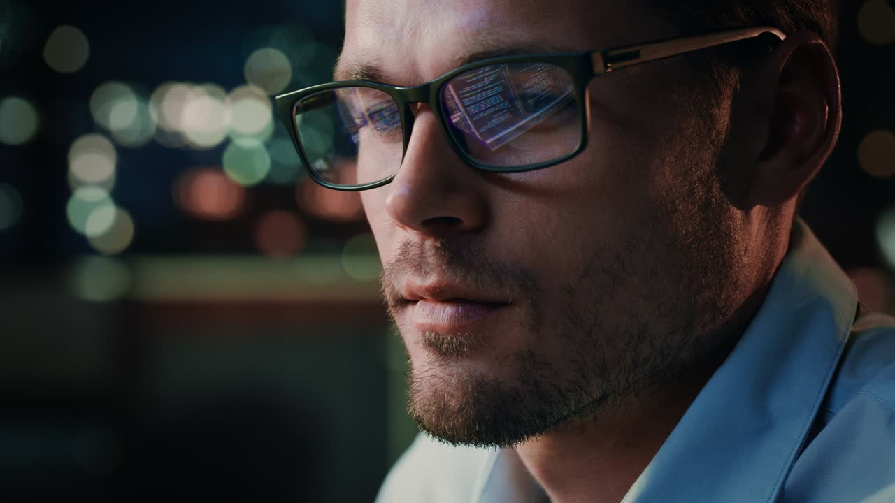 Portrait of Handsome Startup Digital Entrepreneur Working on Computer, Line of Code Reflecting in Glasses. Developer Working on Innovative e-Commerce Application using AI Algorithm to use Big Data