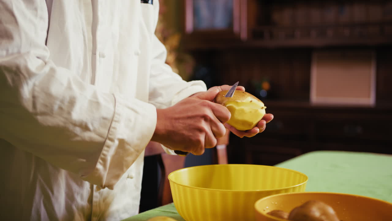 Hands Of A Male Private Chef At Home Peel Potatoes Before Service At Restaurant