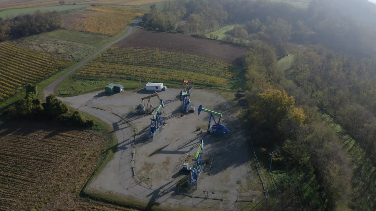 Aerial Of Oil Pumps Working Under The Sunlight