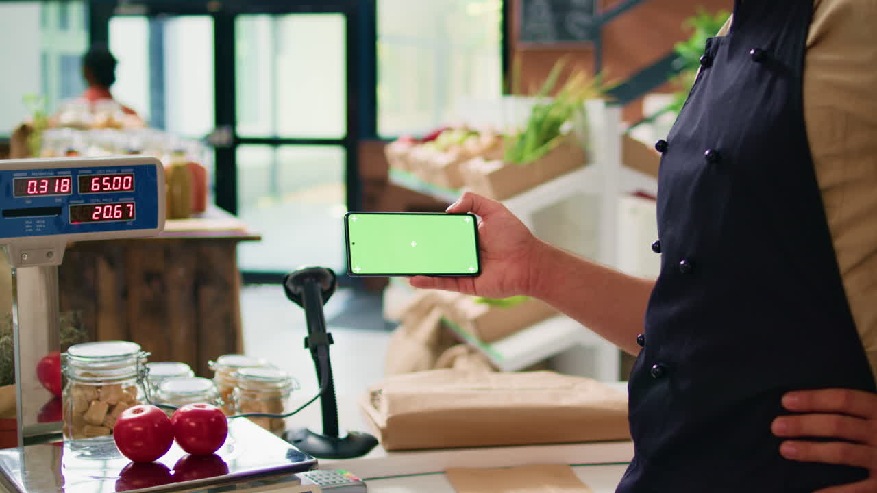 comerciante con pantalla verde de teléfono