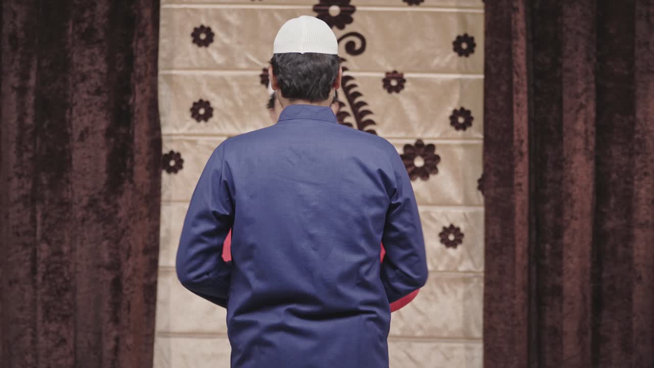 Indian muslim men celebrating Eid and hugging each other