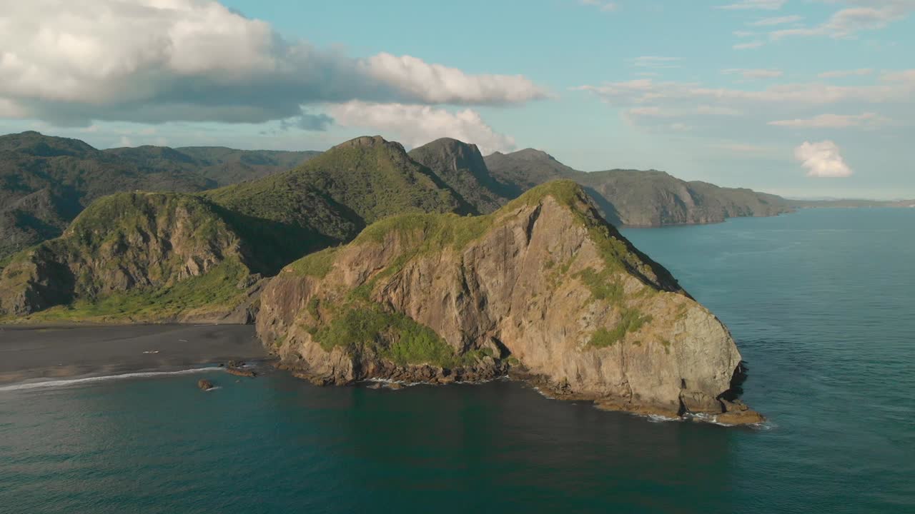 Aerial view of beatiful rock on black sand Whatipu Beach, New Zealand