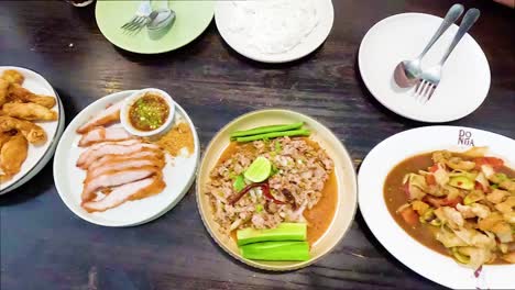 delicious thai dishes shared at a table