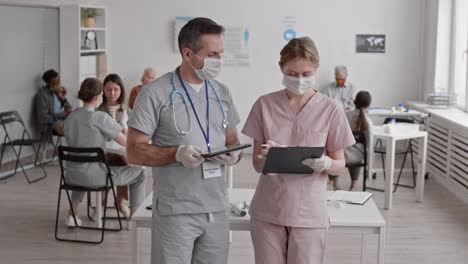 two doctors talking and posing