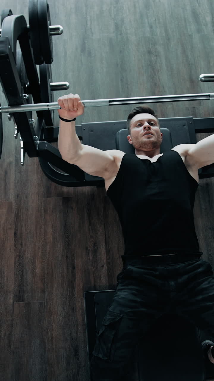 Muscular Man Doing Barbell Exercise