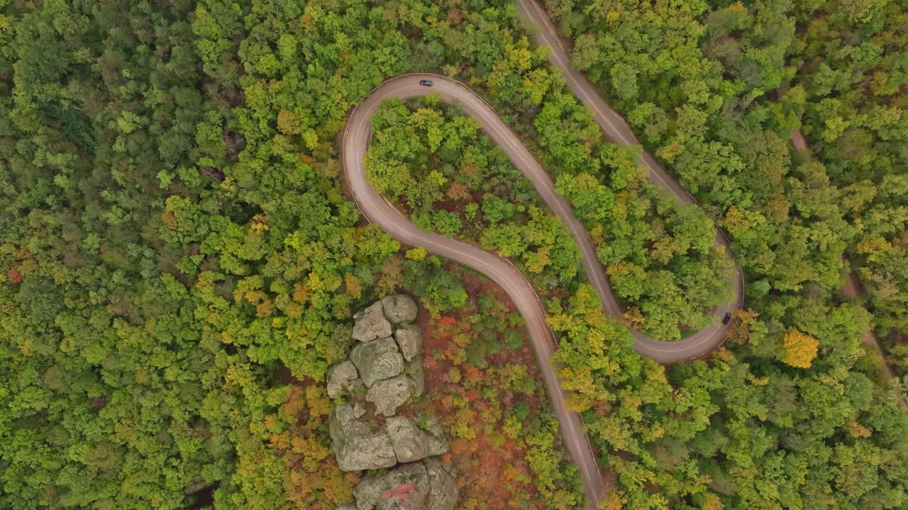 Scenic aerial of winding route through fall landscape, Bulgaria