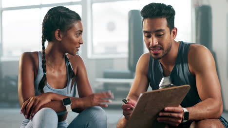 fitness, clipboard and personal trainer talking to