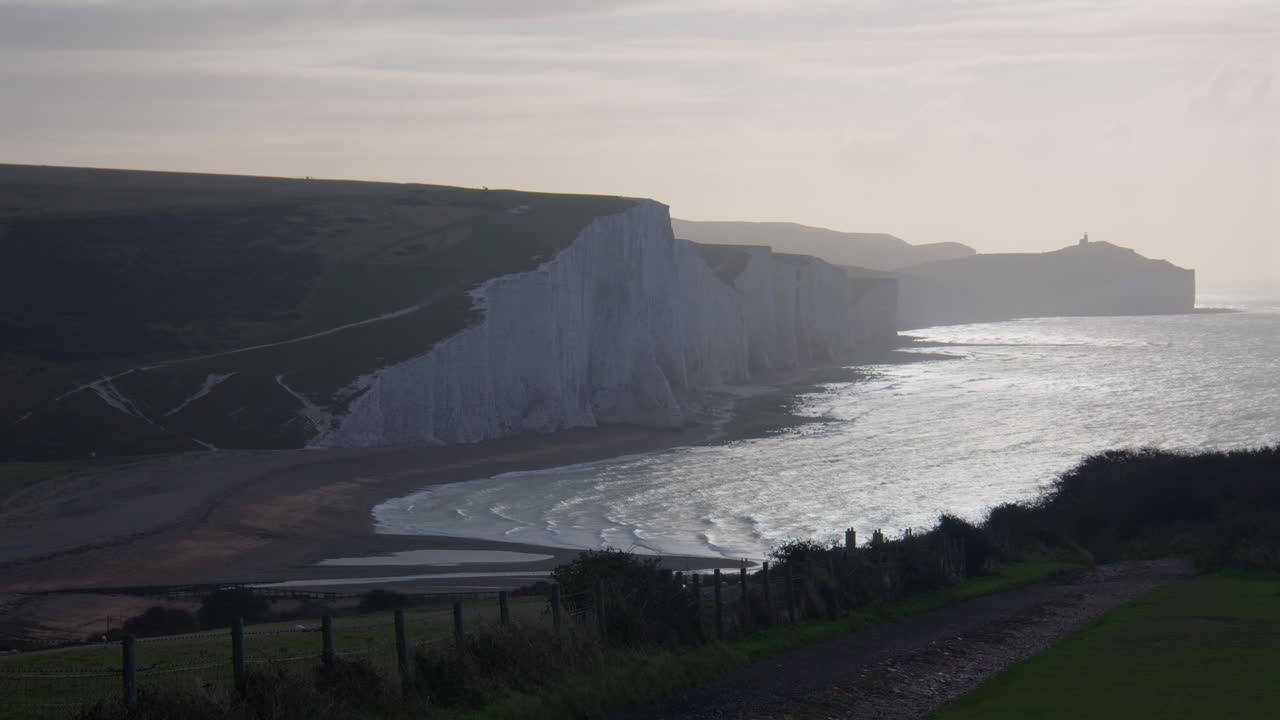 wide Early morning shot of the Seven Sisters cliffs with track