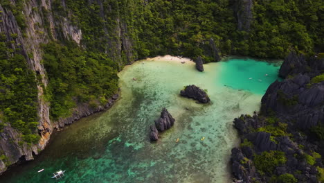 aerial view of secluded tropical beach in el nido, philippines