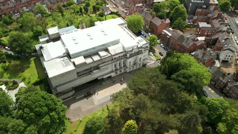 advancing overhead aerial video of ulster museum in botanic gardens in belfast, northern ireland on a bright sunny day. produced in 4k, 60 frames per second and with rec709 color.