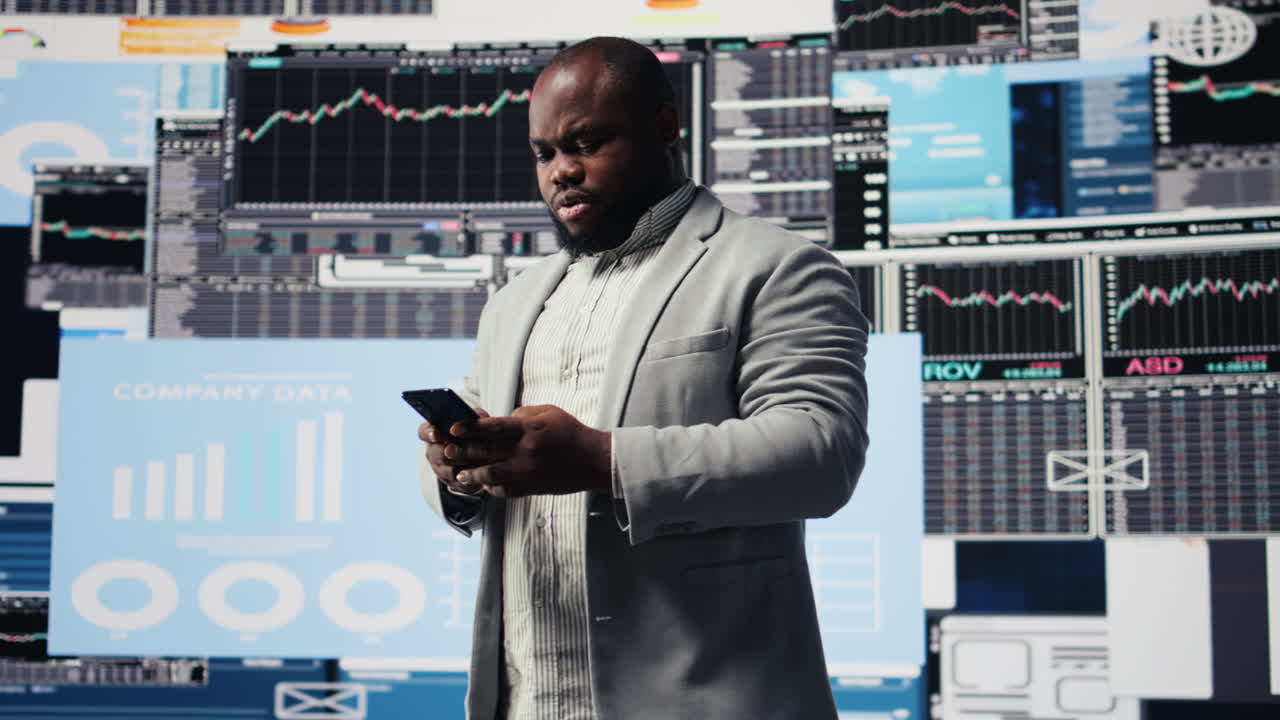 Young business leader checking online fintech reports on mobile phone