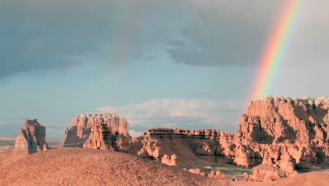 slow right pan of a double rainbow fading until only one remains